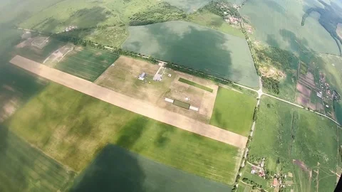 Skydiver uses hand-held parachute altimeter to know height Stock Footage 236849885