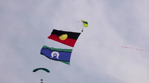 Skydivers Display Aboriginal and Torres Strait Flags Stock Footage 310081512