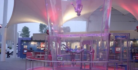 Skydivers Float In Wind Tunnel Together Video stock 76497455