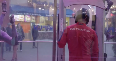 Skydivers Float In Wind Tunnel Together 3 Video stock 76497759