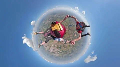 Skydivers having fun small planet view Foto stock