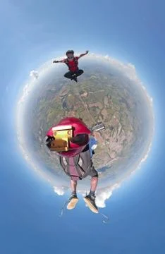 Skydivers having fun small planet view Foto stock