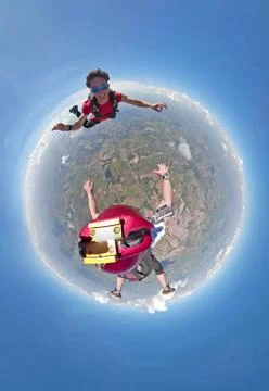 Skydivers having fun small planet view Foto stock