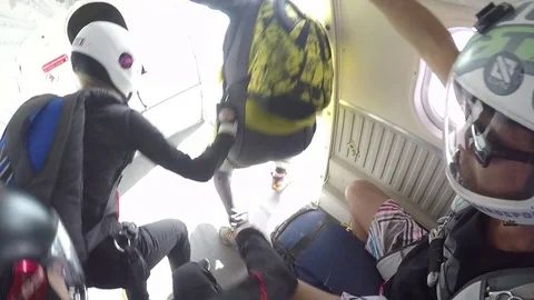 Skydivers Jump Out of Helicopter Video stock 79737434