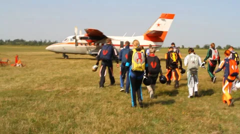 Skydivers landing of the plane Stock Footage 33382490