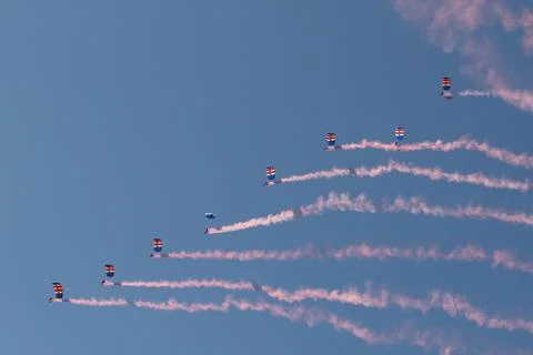 Skydivers Performing Precision Formation With Smoke Trails Fotos de archivo