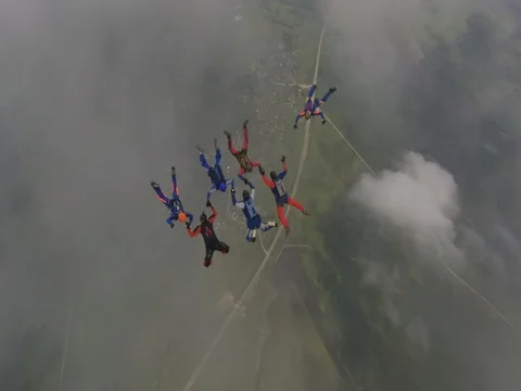 Skydivers in the sky Stock Footage 77310653