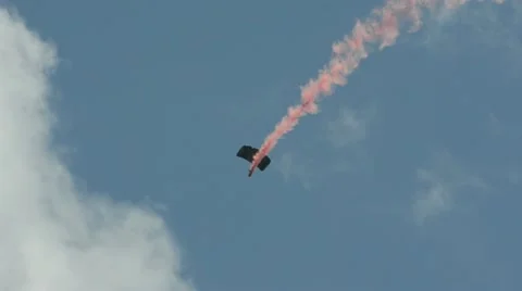 Skydivers with smoke trail Stock Footage 10910156