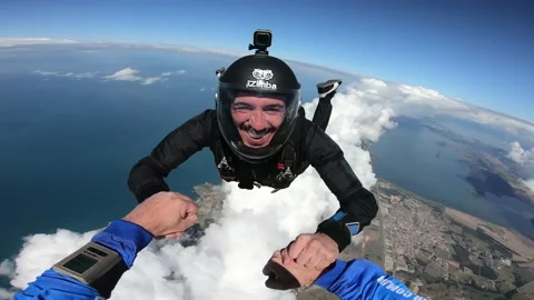 Skydiving above the clouds Stock Footage 130277356