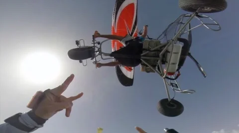 Skydiving above the ocean from paratrike, exit 3000 feet, with base system. Stock Footage 46010543