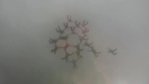 Skydiving formation with clouds Stock Footage 145242007