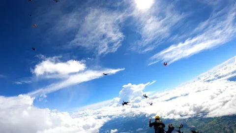 Skydiving formation with clouds Stock Footage 145243860