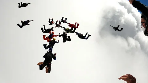 Skydiving formation with clouds Stock Footage 145248530