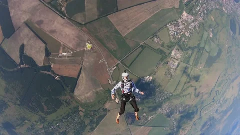 Skydiving, free fall, a man in the clouds, parachutists jump out of an airplane Stock Footage 172089105