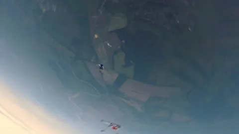 Skydiving, free fall, a man in the clouds, parachutists jump out of an airplane Stock Footage 172089106