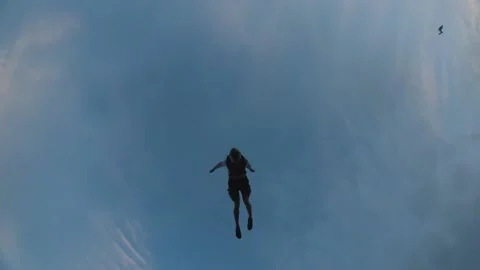 Skydiving, free fall, a man in the clouds, parachutists jump out of an airplane Stock Footage 172089121