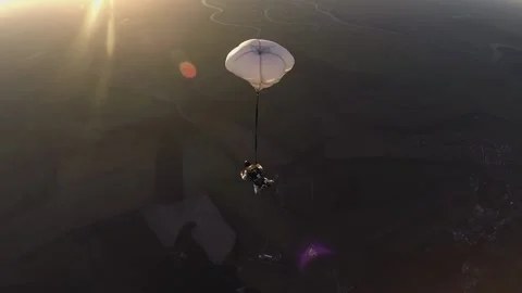 Skydiving, free fall, a man in the clouds, parachutists jump out of an airplane Stock Footage 172089177