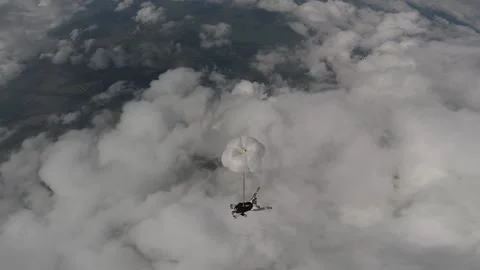 Skydiving, free fall, a man in the clouds, parachutists jump out of an airplane Stock Footage 172089178