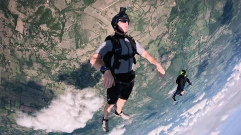 Skydiving, Free Fall, Two Parachutists jumping and performing maneuvers in Video stock 259028033