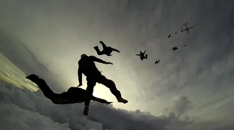 Skydiving group above the clouds Stock Footage 54176424