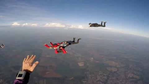 Skydiving group formation at the sunset Stock Footage 128022041