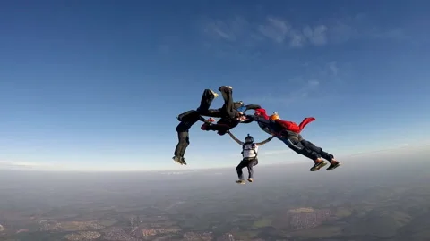 Skydiving group at the sunset Stock Footage 128018621