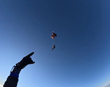 Skydiving jump under the clear blue sky Stock Photos