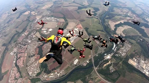 Skydiving large group formation clear sky Stock Footage 142770024
