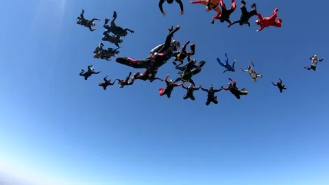 Skydiving large group formation clear sky take off Stock Footage 142771182