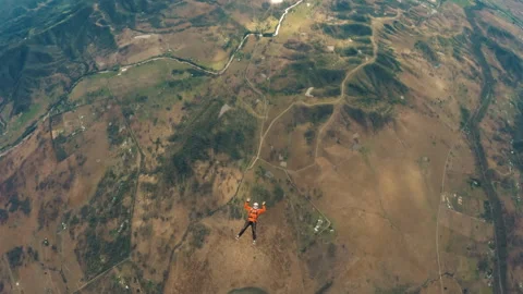 Skydiving Man falling down to earth Stock Footage 264505410