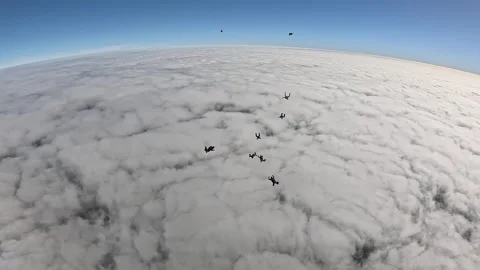 Skydiving over the clouds Stock Footage 319668943