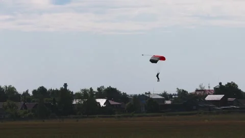 Skydiving. The parachutist lands on the ground Stock Footage 247270070