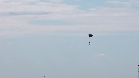 Skydiving. The parachutist lands on the ground Stock Footage 247270168