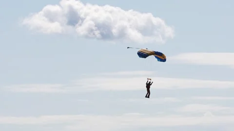 Skydiving. The parachutist lands on the ground Stock Footage 247270294