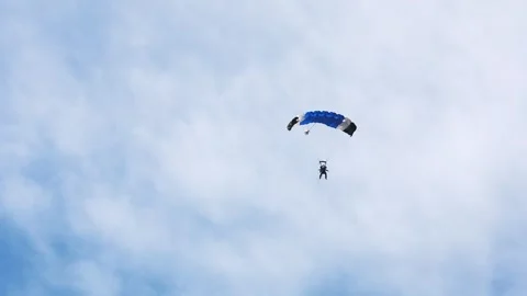 Skydiving. The parachutist lands on the ground Stock Footage 247270424
