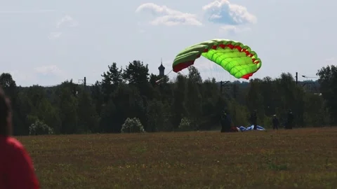 Skydiving. The parachutist lands on the ground Stock Footage 247270670
