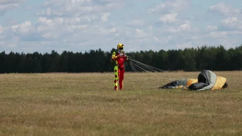 Skydiving. The parachutist lands on the ground Stock Footage 247271441