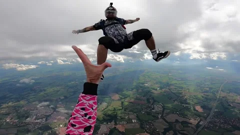 Skydiving point of view above the clouds Stock Footage 219625115