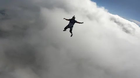Skydiving point of view above the clouds Stock Footage 219625278