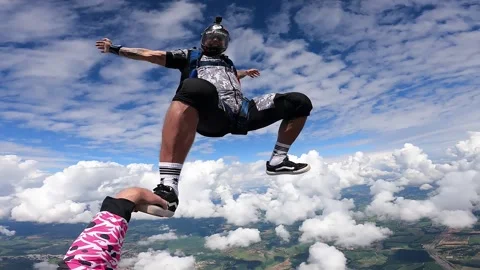 Skydiving point of view above the clouds Stock Footage 219625447