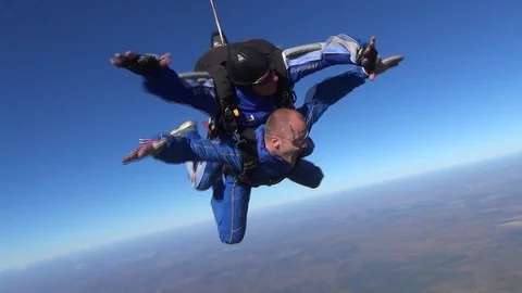 Skydiving tandem during Free Fall Stock Footage 105425312