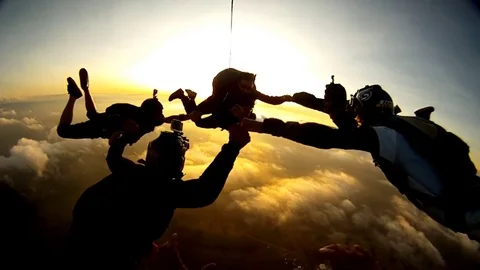 Skydiving tandem sunset group 1080p Stock Footage 79903083