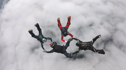 Skydiving team above the clouds Stock Footage 61629718