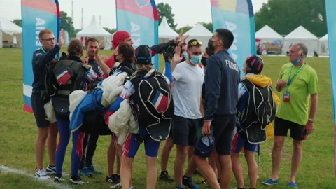 Skydiving Team After Group Jump. Rejoice. Give Five. Teamwork. Trick done Stock Footage 196202940