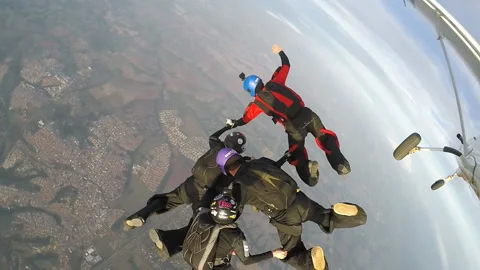 Skydiving teamwork Stock Footage 96010491