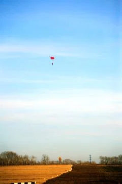 Skydiving training at a flying school in autumn in a blue sky, one skydiver. 写真素材