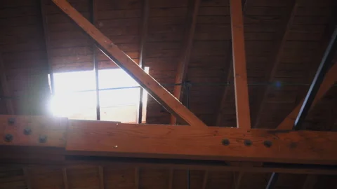 Skylight window on the ceiling in a building with sun rays and dust flying in Stockbeeldmateriaal 291579619