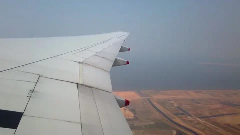 Skyline And Wing Of Airplane From Window With A Nice Blue Sky Stock Footage 158016685