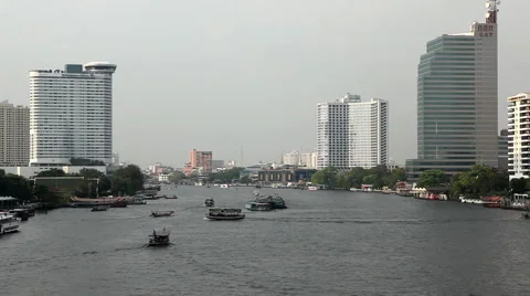 Skyline, Chao Phraya River in Bangkok, Thailand, View from Taksin Bridge, Boats Stock Footage