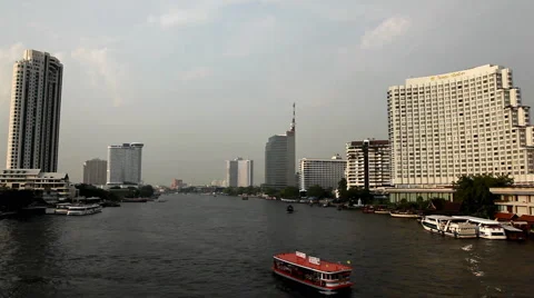 Skyline, Chao Phraya River in Bangkok, Thailand, View from Taksin Bridge, Boats Stock Footage